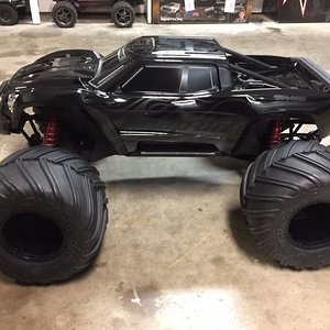 X-maxx With Losi 1/5 scale monster claw tires.